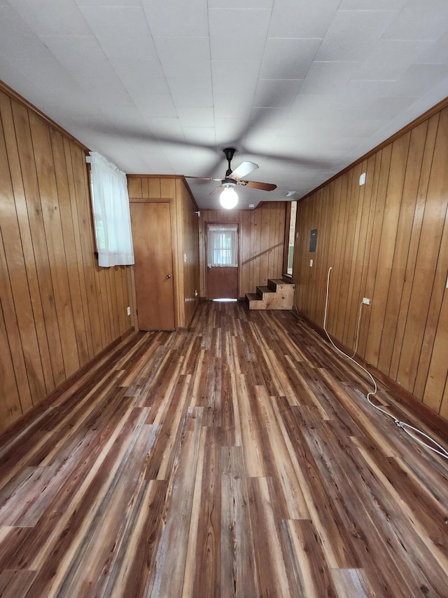 4029 Karen Dr, North Charleston, SC 29405 - unfurnished living room featuring wood-type flooring, a ceiling fan, and wooden walls