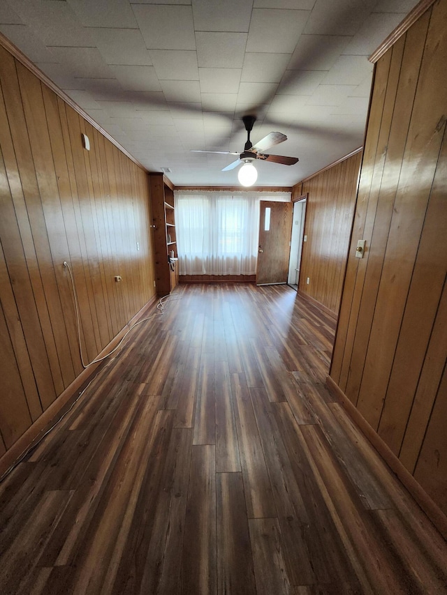4029 Karen Dr, North Charleston, SC 29405 - unfurnished room with dark wood-type flooring, wood walls, and a ceiling fan