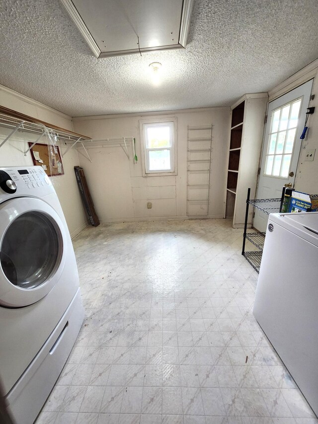 4029 Karen Dr, North Charleston, SC 29405 - laundry area featuring washer / dryer, plenty of natural light, light floors, and a textured ceiling