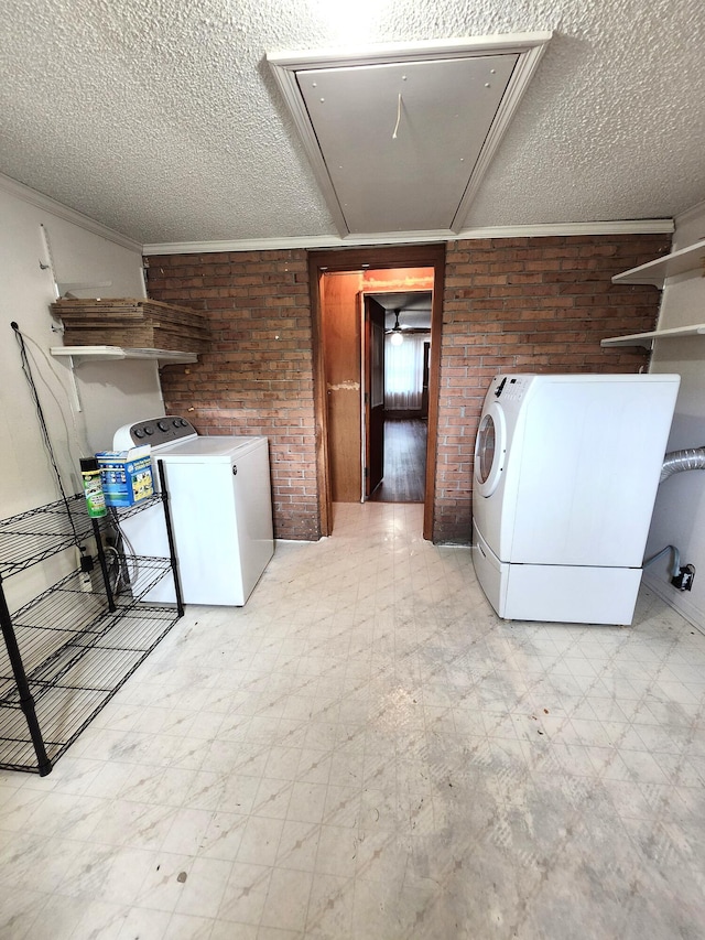 4029 Karen Dr, North Charleston, SC 29405 - laundry area with tile patterned floors, independent washer and dryer, attic access, brick wall, and a textured ceiling