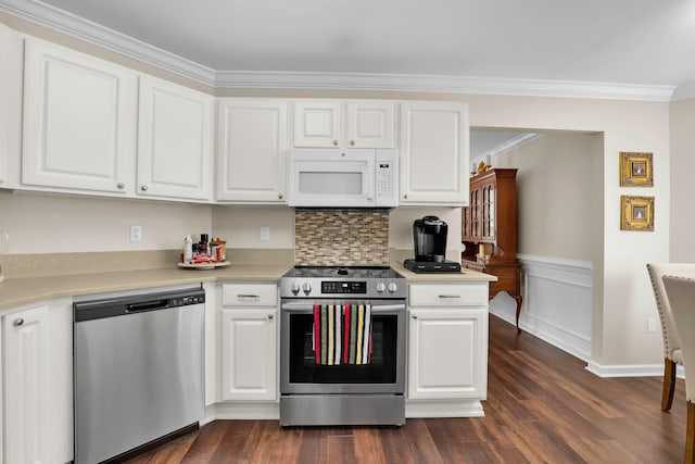 kitchen featuring dark wood-style floors, white cabinetry, stainless steel appliances, and light countertops