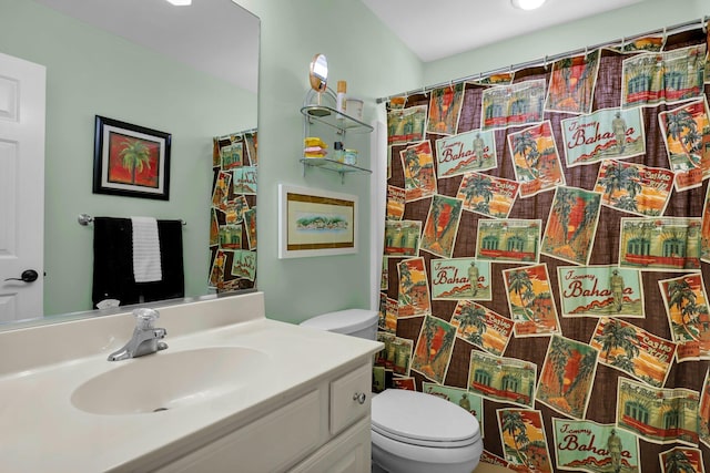 bathroom featuring toilet and vanity