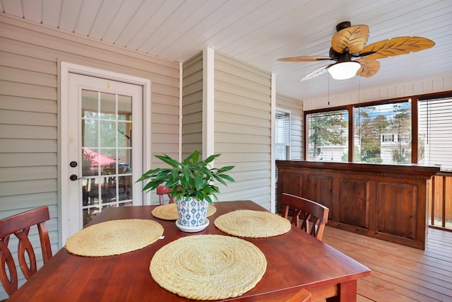 sunroom / solarium featuring wooden ceiling and ceiling fan