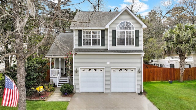 traditional-style home with a front lawn, driveway, a porch, fence, and roof with shingles