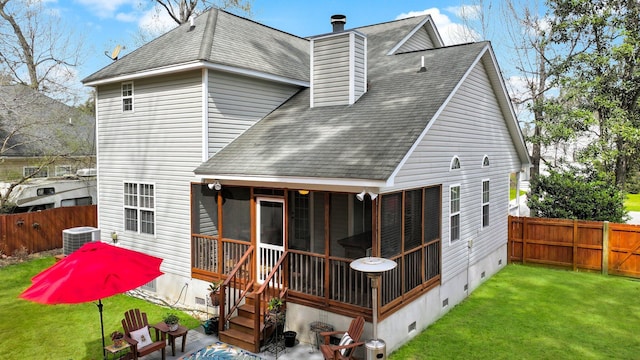 rear view of house with central air condition unit, a shingled roof, a yard, a sunroom, and crawl space