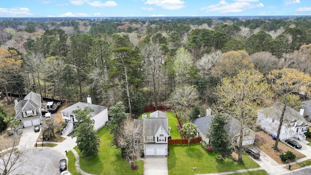 drone / aerial view featuring a forest view