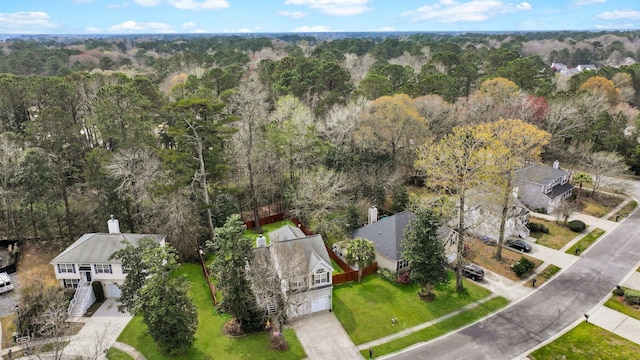 aerial view featuring a wooded view