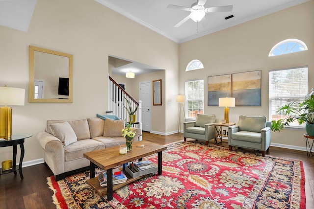 living room featuring stairs, crown molding, wood finished floors, and a ceiling fan