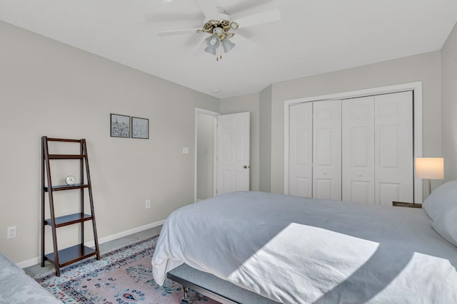 bedroom featuring a closet, carpet flooring, and baseboards