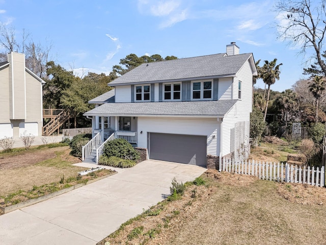 view of front of house featuring a chimney, concrete driveway, covered porch, an attached garage, and fence