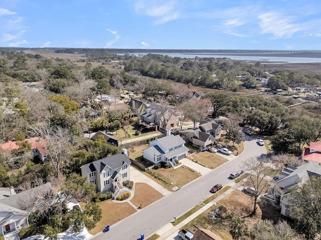 drone / aerial view with a water view and a residential view