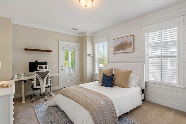 carpeted bedroom featuring ornamental molding, access to outside, and wood walls