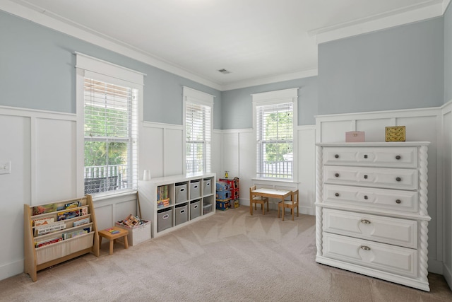 game room featuring ornamental molding and light colored carpet