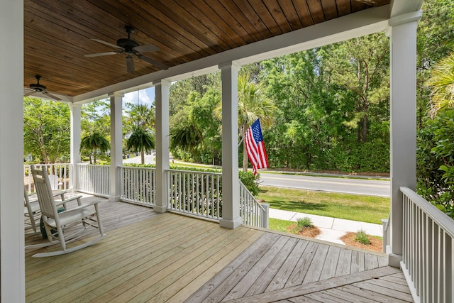 wooden terrace with ceiling fan and a porch