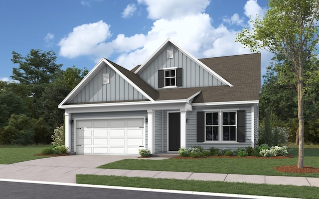 view of front of property with a front lawn and a garage