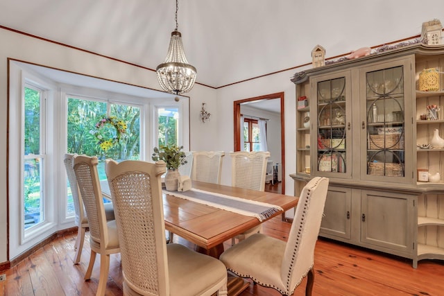 dining area featuring a notable chandelier and light hardwood / wood-style floors