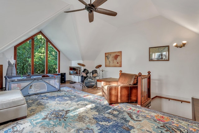 bedroom featuring light hardwood / wood-style floors, ceiling fan, and lofted ceiling