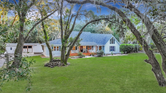 view of front of home with a front lawn and covered porch