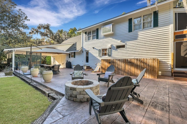 view of patio / terrace with an outdoor fire pit