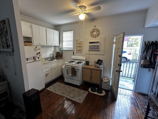 kitchen featuring white cabinetry, white appliances, dark wood-type flooring, ceiling fan, and sink