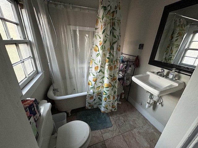 full bathroom with sink, shower / bathtub combination with curtain, tile patterned flooring, and toilet