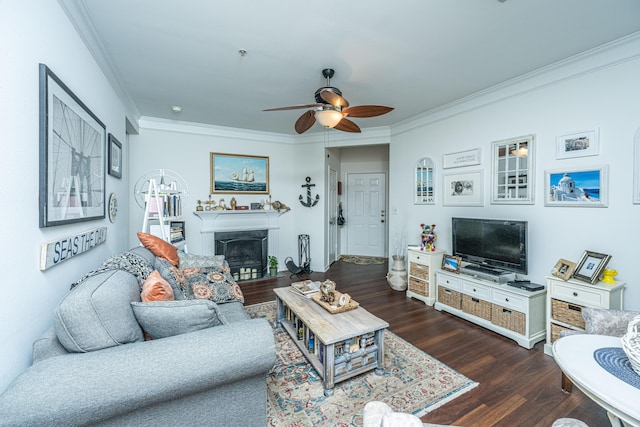 living room with dark hardwood / wood-style flooring, crown molding, and ceiling fan