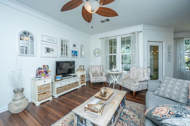 living room featuring crown molding, ceiling fan, and dark hardwood / wood-style floors