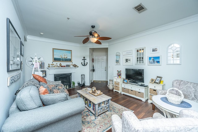 living room featuring crown molding, hardwood / wood-style floors, and ceiling fan