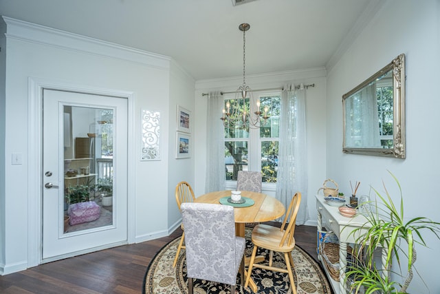 dining space with a notable chandelier, crown molding, and dark wood-type flooring