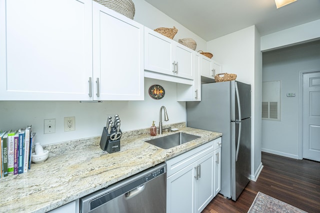 kitchen with stainless steel appliances, dark hardwood / wood-style floors, sink, and white cabinets