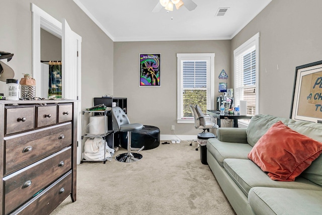 interior space with ornamental molding and ceiling fan