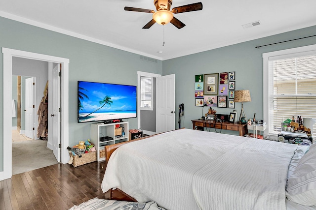 bedroom with ceiling fan and dark hardwood / wood-style floors