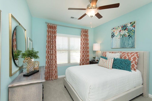 bedroom with light carpet and ceiling fan