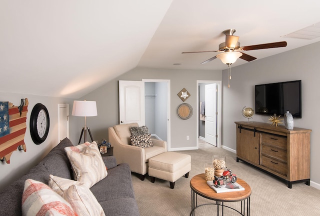 living room featuring lofted ceiling, ceiling fan, and light colored carpet