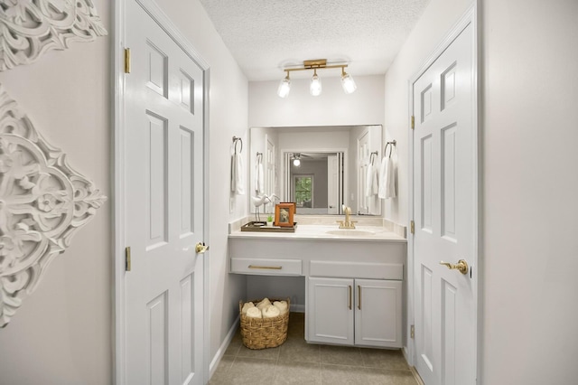 105 Spring St, Summerville, SC 29485 - bathroom with tile patterned floors, vanity, and a textured ceiling