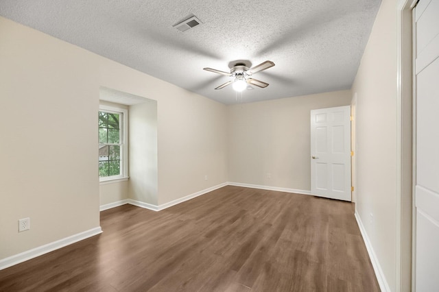 105 Spring St, Summerville, SC 29485 - empty room featuring dark wood-type flooring, ceiling fan, and a textured ceiling