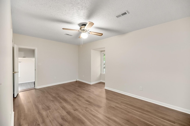 105 Spring St, Summerville, SC 29485 - empty room with a ceiling fan, wood finished floors, and a textured ceiling