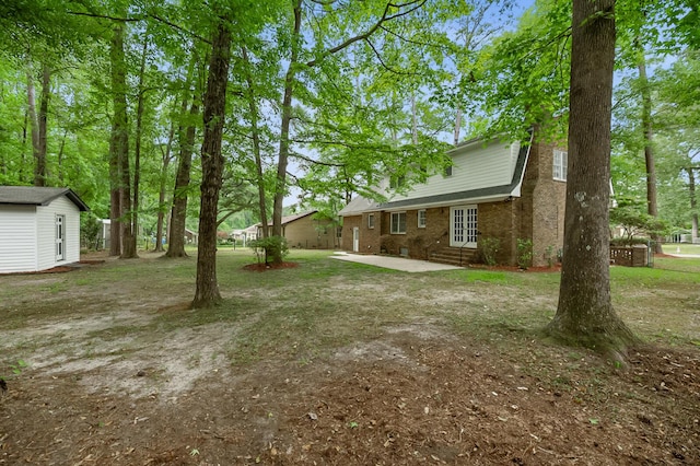105 Spring St, Summerville, SC 29485 - view of yard with a patio and an outbuilding