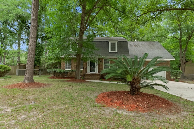 105 Spring St, Summerville, SC 29485 - dutch colonial featuring brick siding, driveway, and roof with shingles