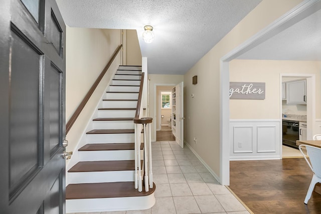 105 Spring St, Summerville, SC 29485 - staircase featuring a textured ceiling and tile patterned flooring