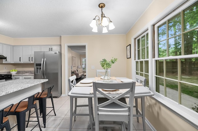 105 Spring St, Summerville, SC 29485 - dining room with healthy amount of natural light, a chandelier, light tile patterned floors, and a textured ceiling