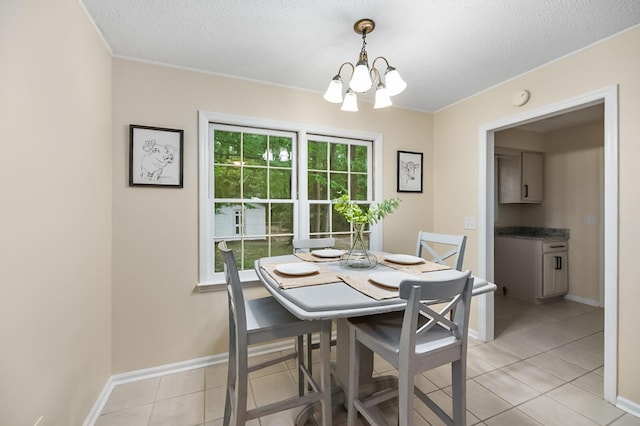 105 Spring St, Summerville, SC 29485 - dining space featuring a chandelier, light tile patterned flooring, and a textured ceiling