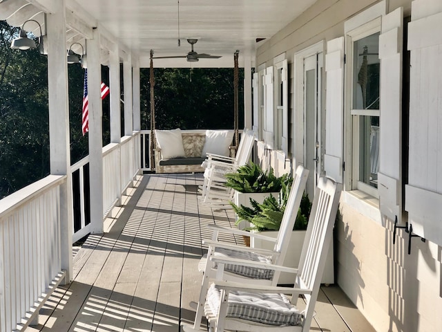 balcony featuring covered porch and a ceiling fan