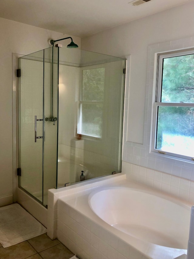 full bathroom with visible vents, a stall shower, a bath, and tile patterned floors