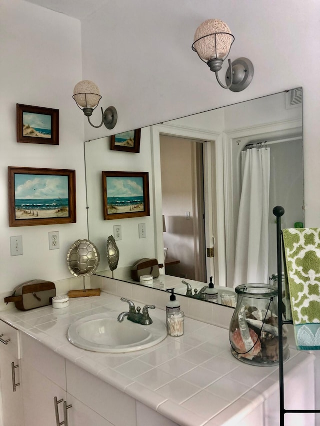 bathroom with visible vents and vanity