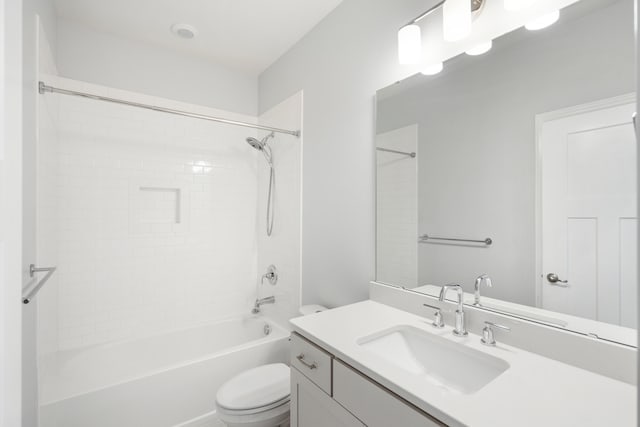 full bathroom featuring vanity, toilet, and tiled shower / bath combo