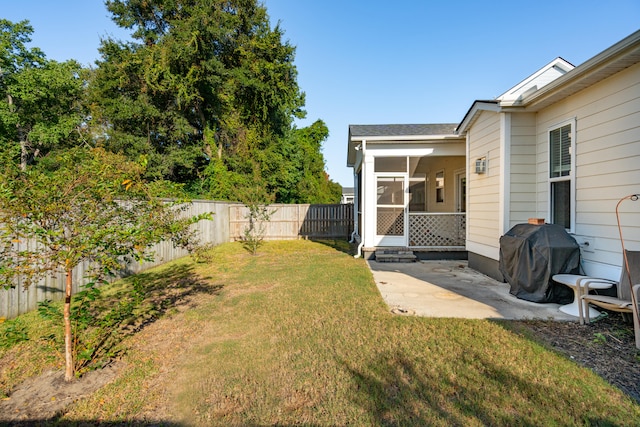 view of yard featuring a sunroom