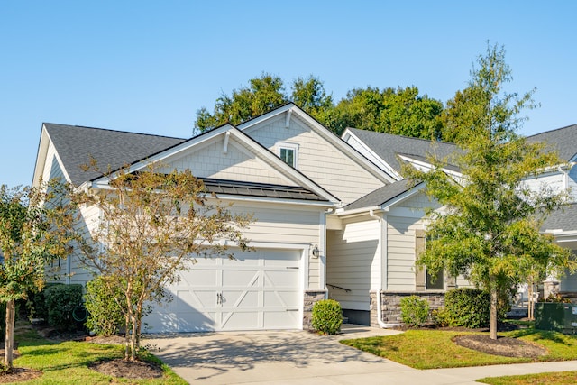 view of front of house with a front lawn and a garage