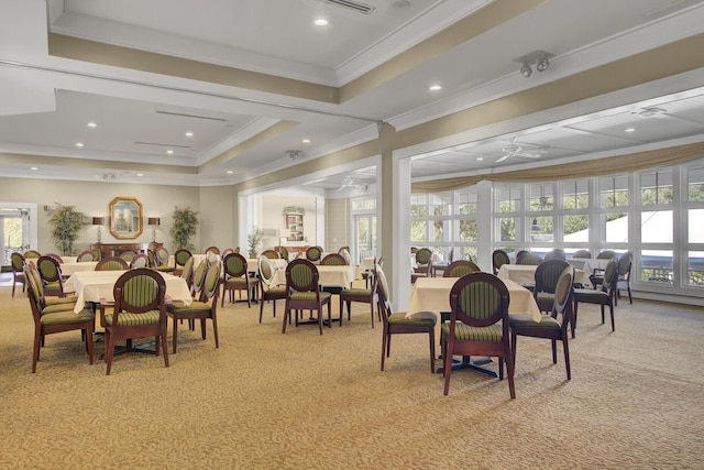 4227 Sawgrass Dr, North Charleston, SC 29420 - dining area featuring light colored carpet, plenty of natural light, a ceiling fan, crown molding, and a tray ceiling