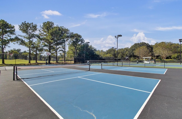 4227 Sawgrass Dr, North Charleston, SC 29420 - view of tennis court with community basketball court and view of wooded area